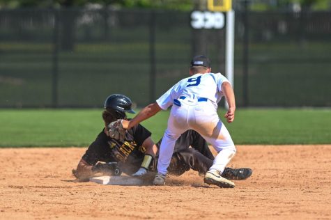 Shortstop Logan Riley tags out the runner from first base during a home game against Black Hawk College on Saturday, May 6, 2023.