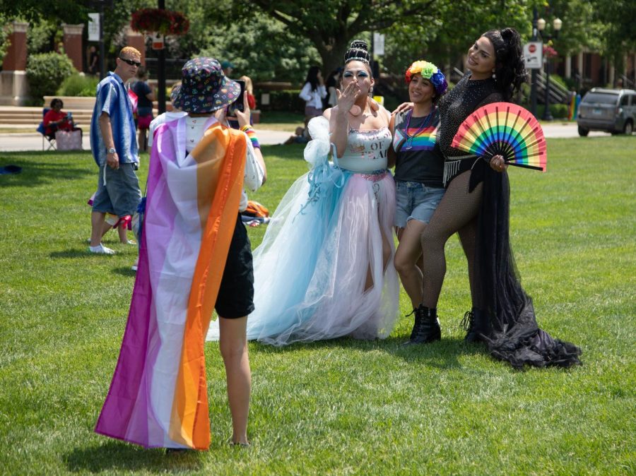 Tiffany Perez of Elgin poses for a photo with drag performers during Elgins Pride Festival at Festival Park in Elgin on Saturday, June 3, 2023. 