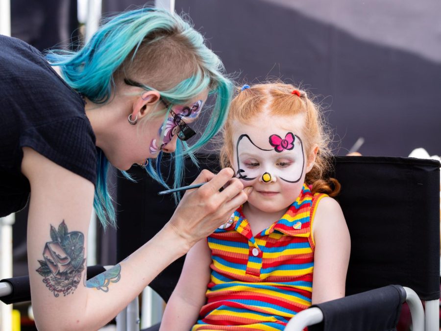 Clementine Geist, 3, gets her face painted during Elgins Pride Festival at Festival Park in Elgin on Saturday, June 3, 2023. 