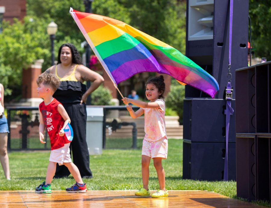Ailani DeJournette, 4, dances with a pride flag during Elgins Pride Festival at Festival Park in Elgin on Saturday, June 3, 2023. 