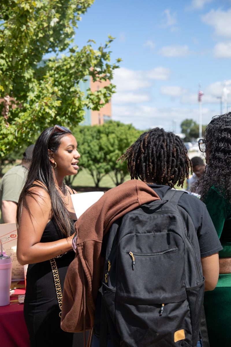 Destiny Guevara (left) promotes Black Student Achievers to eager students during Clubchella on Aug. 30, 2023. 