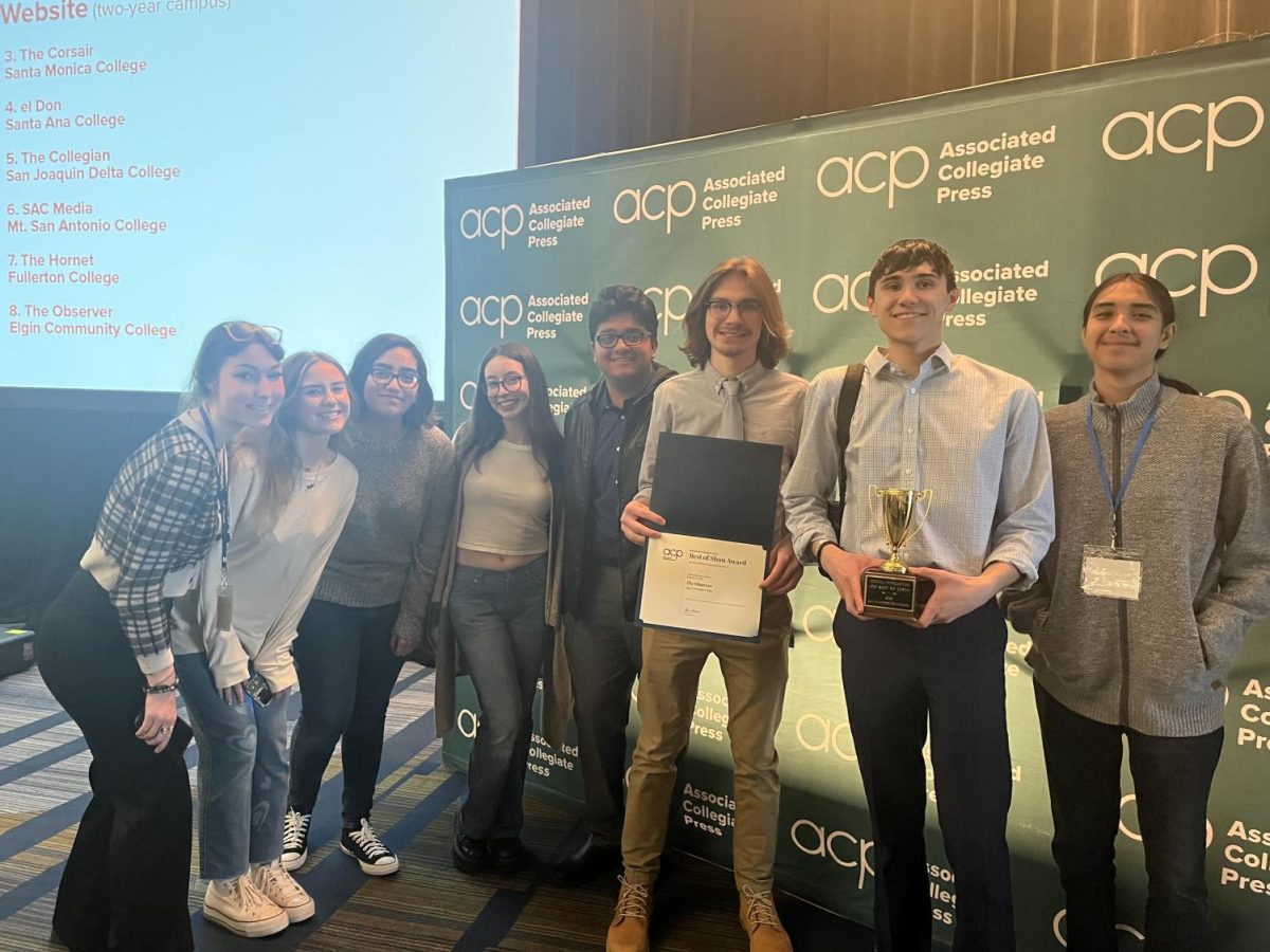 2022-2023 Observer staff posing for a group photo after receiving two awards from the ACP in March 2023.