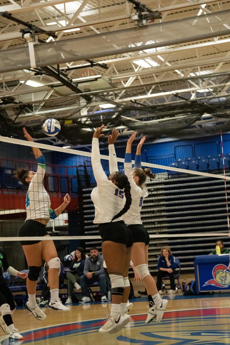 FR. Trinity Evans (15) and FR. Courtney Consoer (8) jump up to block a spike against College of Lake County on Sept. 27, 2023.