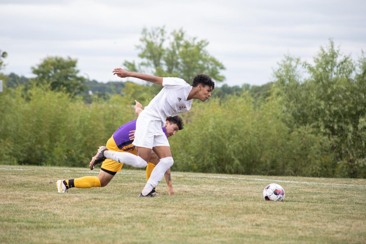 Forward Miguel Navarro (55) beats a McHenry County College defender on Sept. 7, 2023. As of Sept. 13, 2023, the Mens Spartan Soccer team is 2-4.