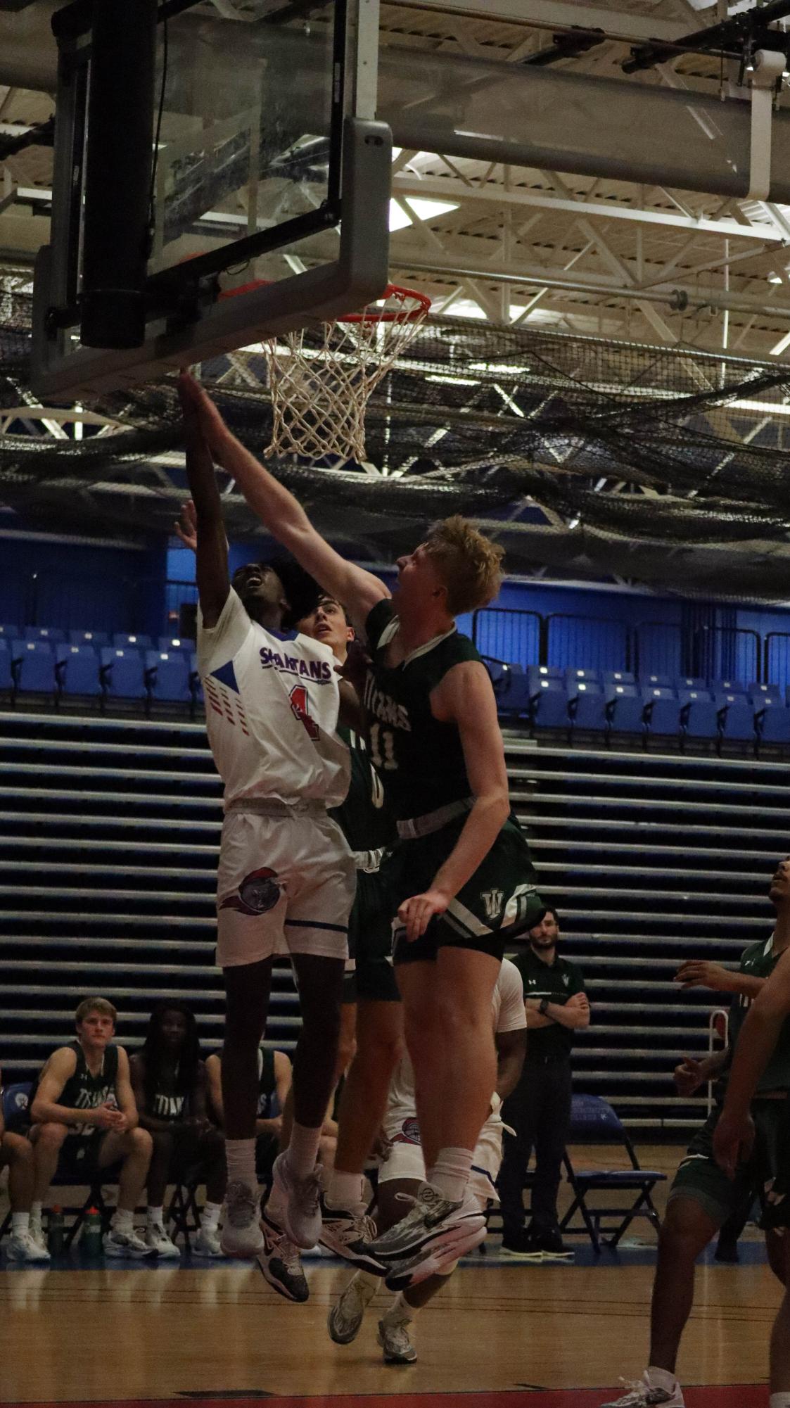 Photos: Men's Basketball loses 85-103 against Illinois Wesleyan University