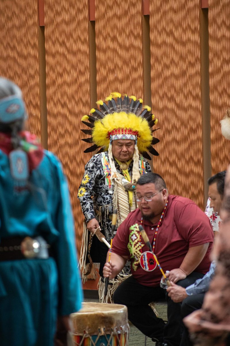 A drum circle plays music while members of the Black Hawk Performance Company perform a culture dance at the Black Hawk Dance Troupe event in the Jobe Lounge on Oct. 11, 2023.