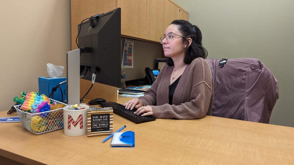 Wellness Professional Migdalia Perez typing in her office. Perez is one of two new wellness professional that started Nov. 11.