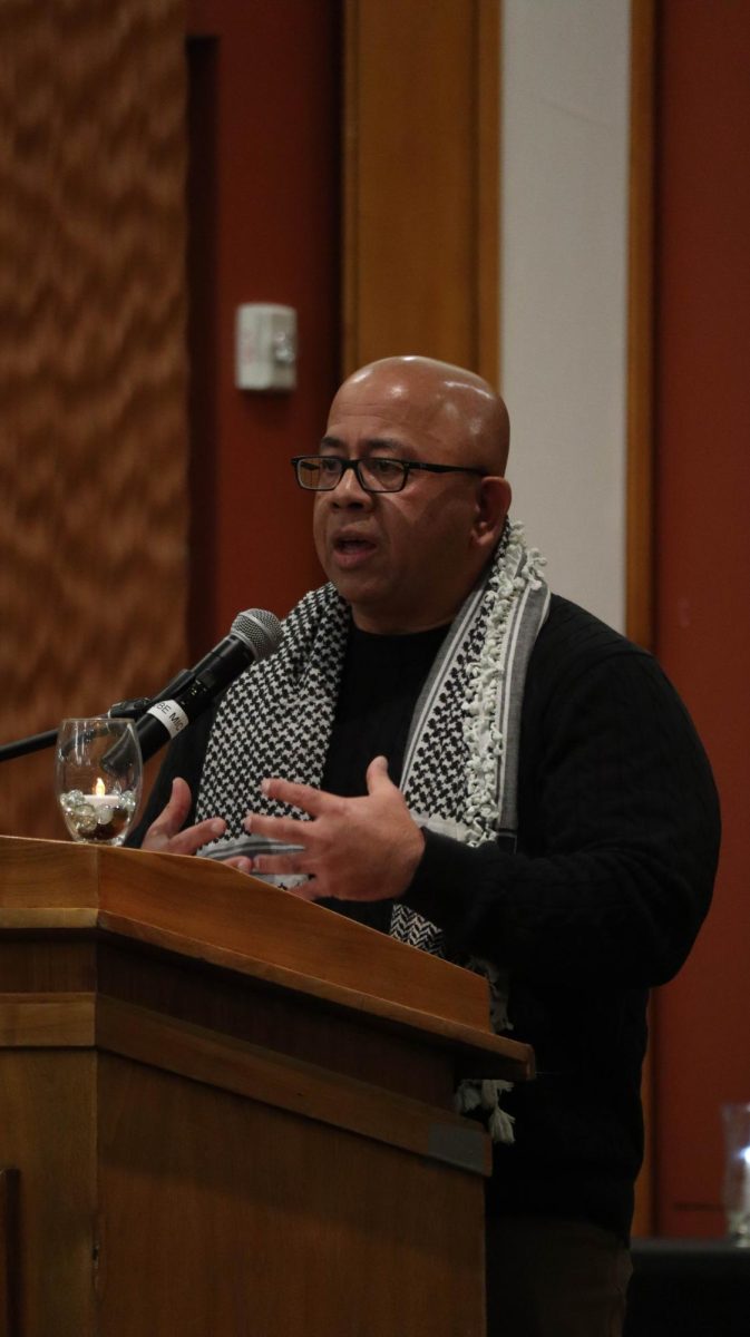 Judge Junaid Afeef speaks on his personal beliefs surrounding the Israel and Palestine conflict at the Candlelight Vigil for Palestine event in the Jobe Lounge on Nov. 29, 2023.