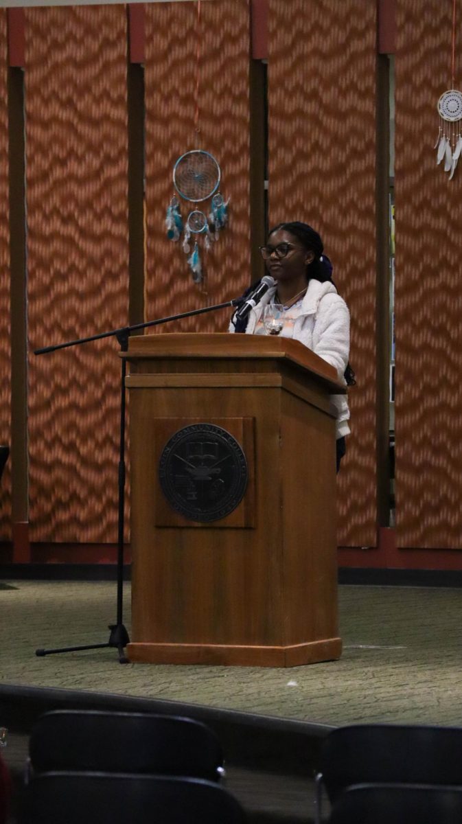 BSA member Diamond Cole reads a prepared speech during the Vigil for Palestine at the Candlelight Vigil for Palestine event in the Jobe Lounge on Nov. 29, 2023.