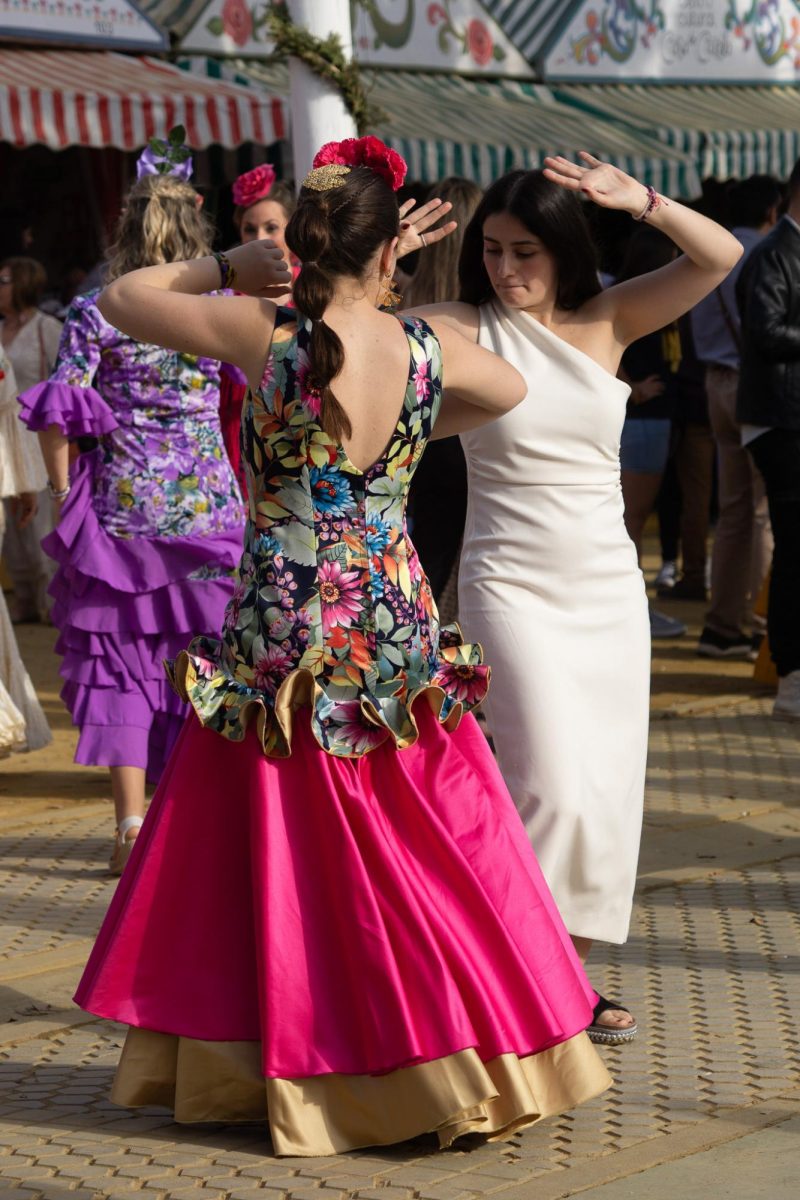 Girls dance Sevillanas, a traditional style of dance native to Andalusia, at la Feria de Abril in Seville, Spain.