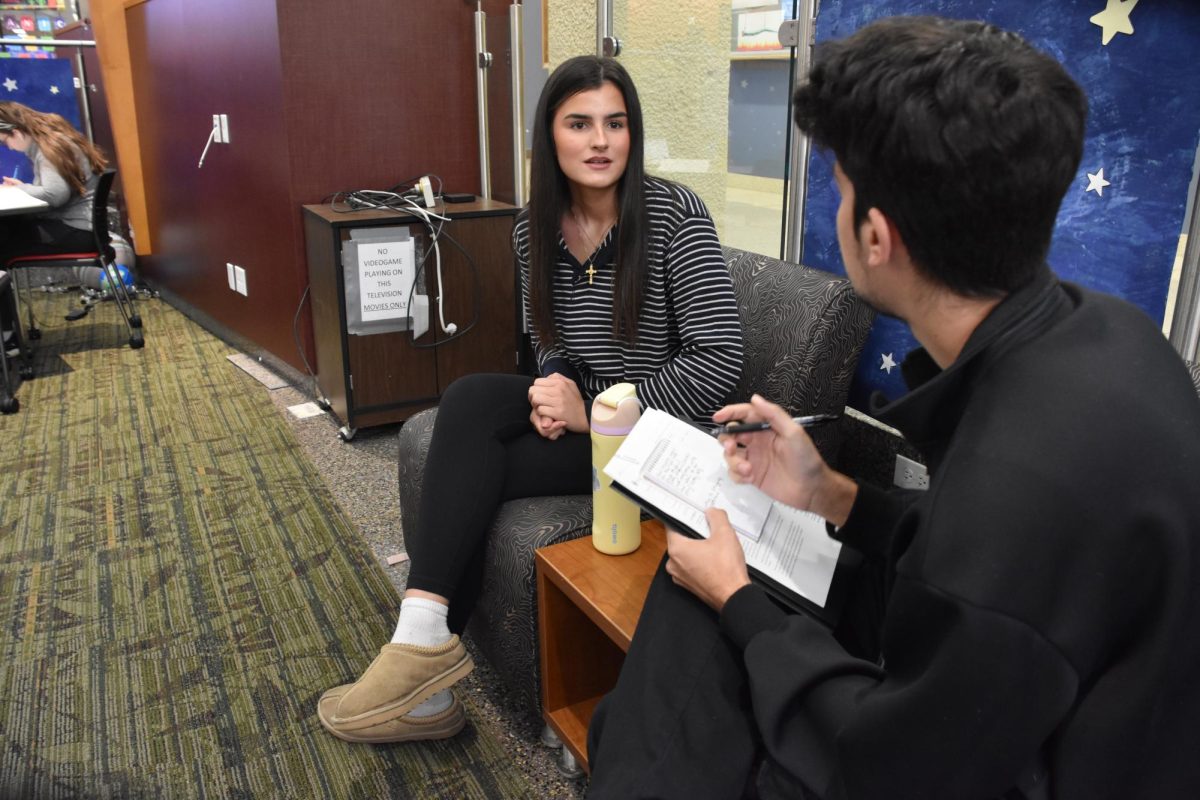 ECC student, Sophia Labree (L) explains to ECC staff writer, Alex Vega, why her prayer life is important to her. "I pray every morning and night. It is important to me because it serves as an extra outlet in being able to say what I do not usually say out loud."