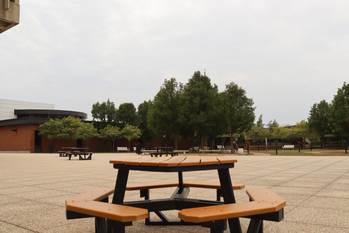 Wood table on the inner rooftop area of Building B on September 19, 2025. This area is accessible by doors near the balcony area of the Jobe Lounge.