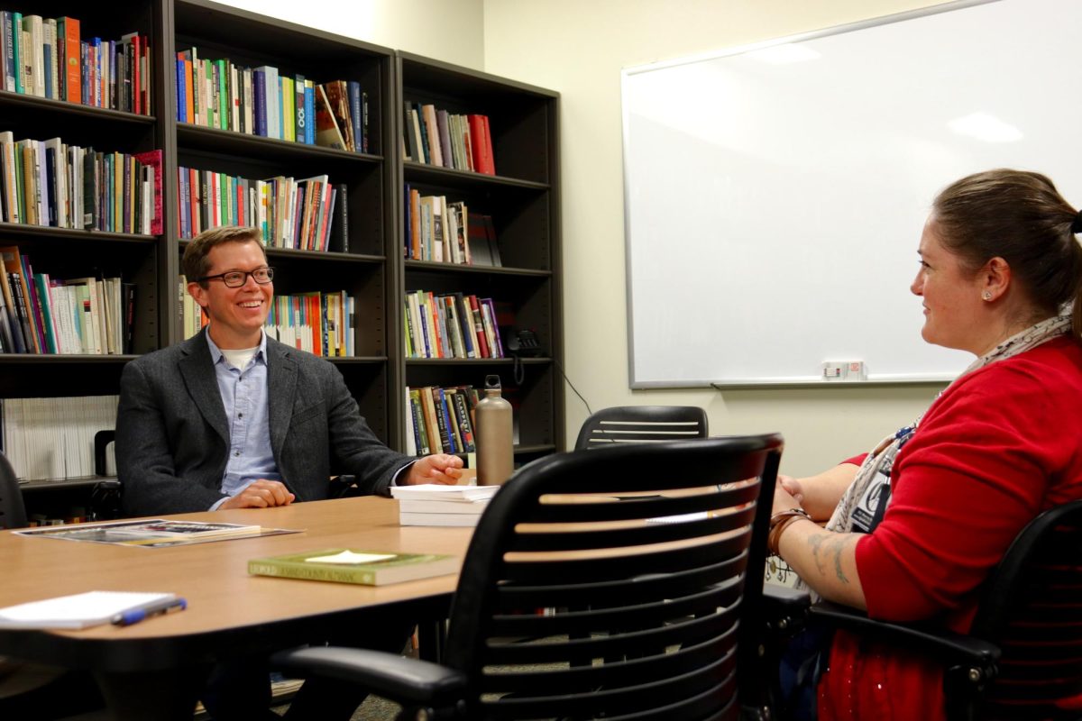 Associate Professor I of English Joshua Thusat and staff writer Monica Marshall discussing ideas on how to find your voice as a writer in classroom B275 Writers Center on August 27, 2025