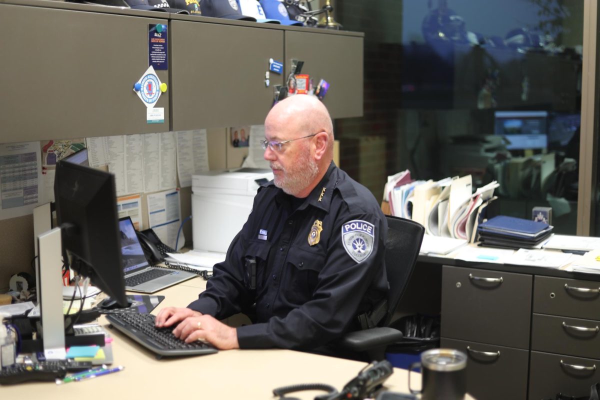Police officer at a desk.
