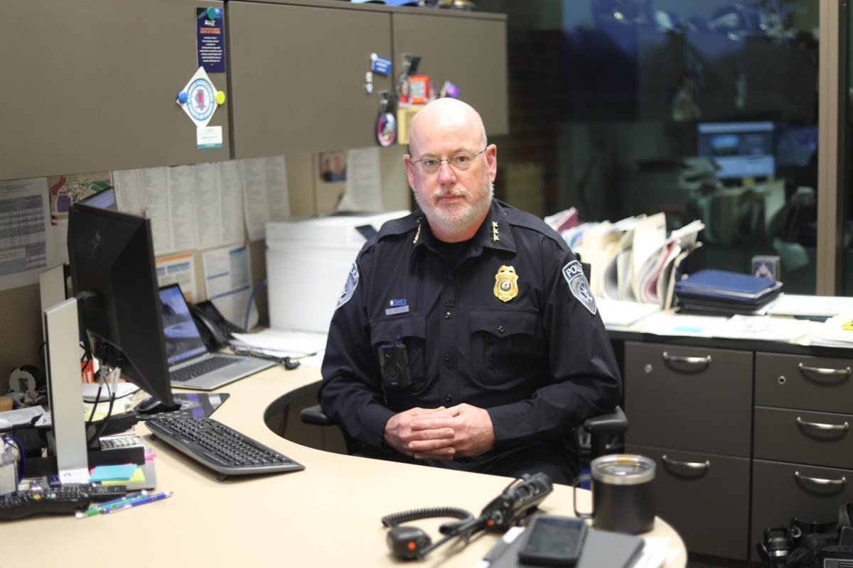 Police officer at his desk.