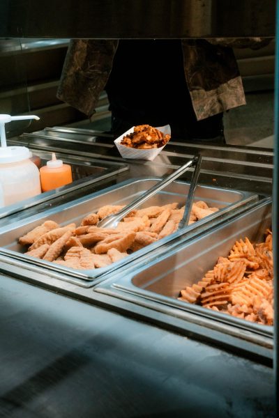 A student gathers fries along with chicken tenders at the college cafeteria on November 11th 2025. Muslim college students have to avoid these options because they are not permissible to eat.