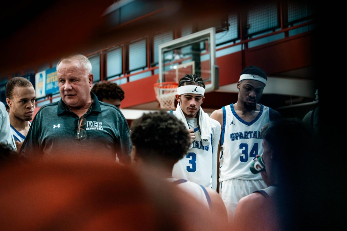 The team gathers around Head Coach Kent Payne, speaking on mistakes that occurred through the first half, on November 25th 2025. The team had a combined 18 turnovers, their second most in a loss this season.