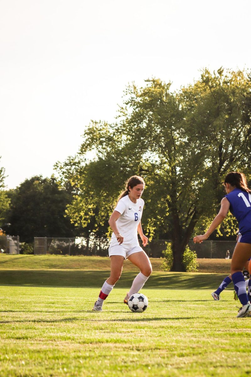 Number 6, Adeline Kinsella, making her way past Harper College's defensive line during Elgin's Sophomore Recognition night on October 17, 2025.