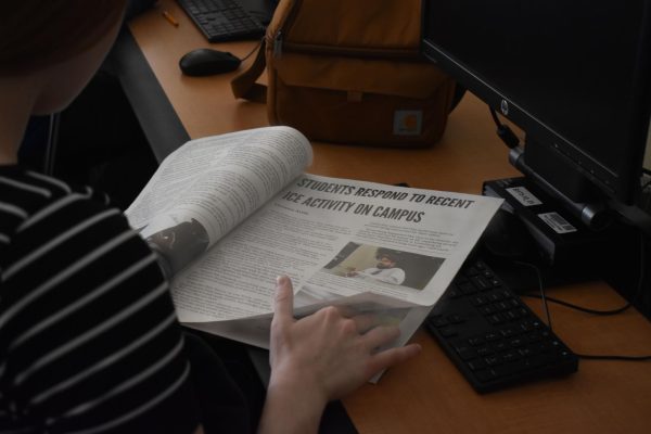 [FILE PHOTO] The November print edition gets passed around during an Observer pitch meeting.