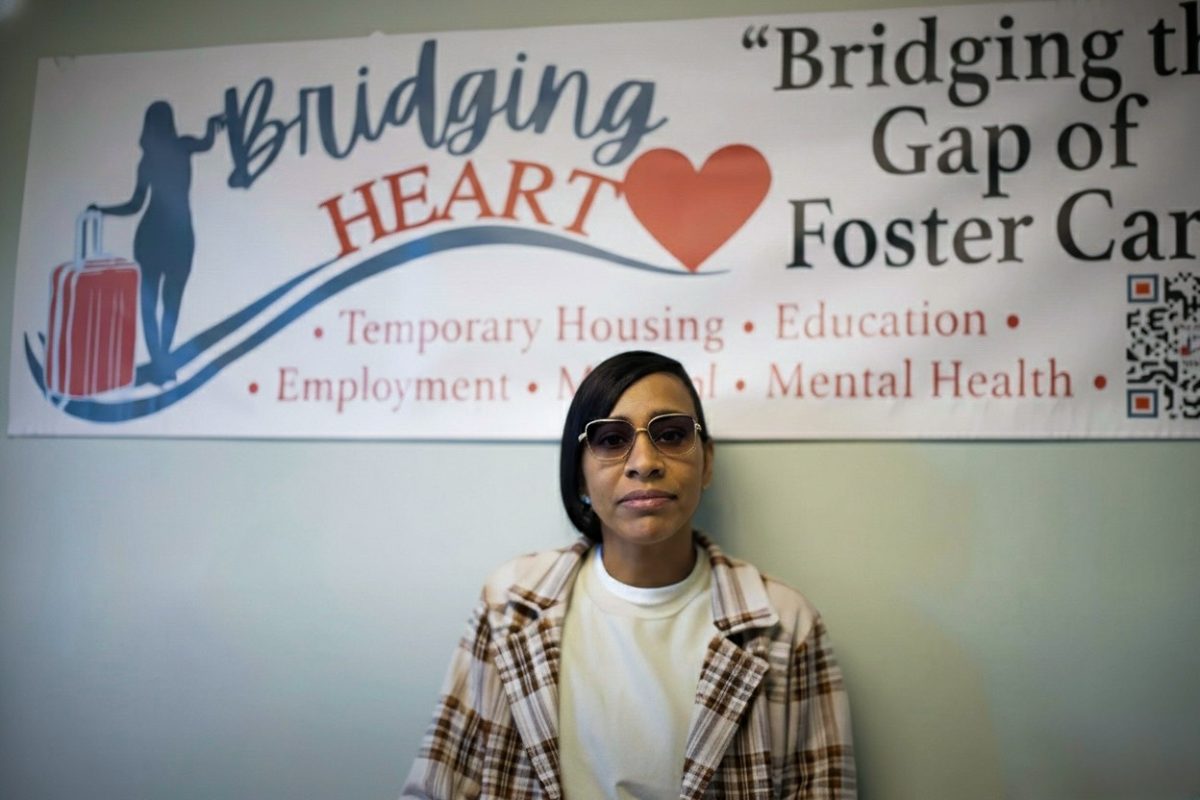 Katina Green, founder of "Bridging Heart" in front of her non-profit banner at her office location in Elgin, Illinois on January 28th, 2026. 