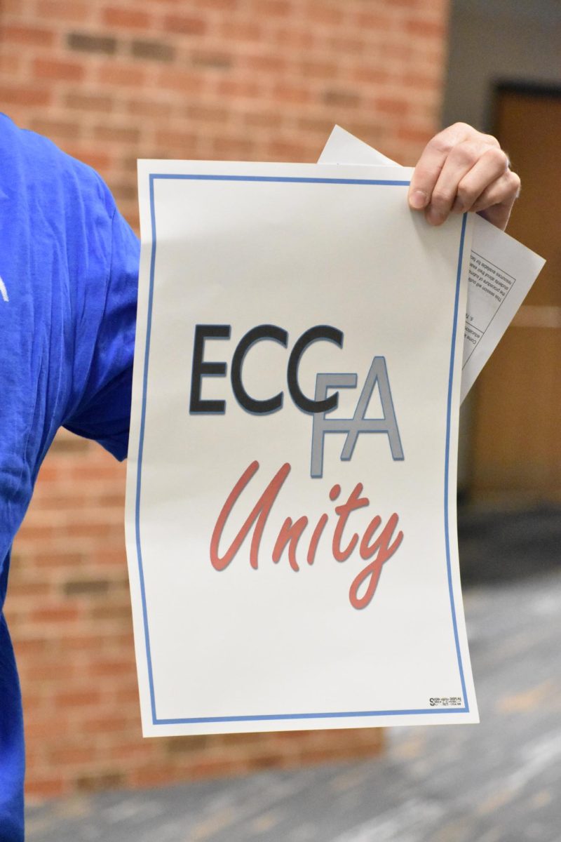 A sign held by an ECCFA member.