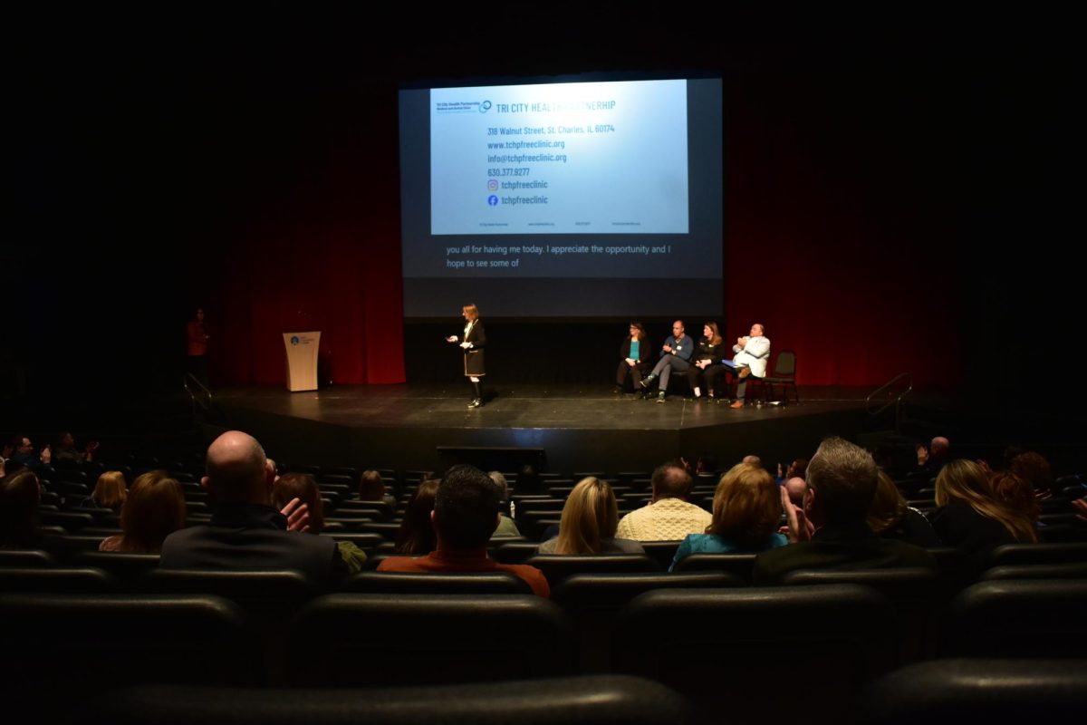 The Blizzard Theatre is lacking attendees, as speakers present information.