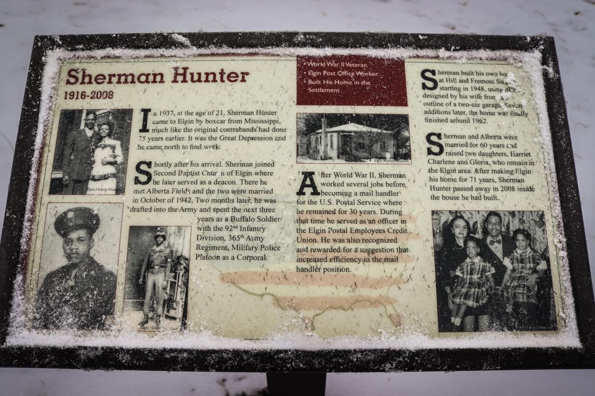 A sign in Newsome Park, Elgin, dedicated to Sherman Hunter, on January 30, 2026. Hunter served as a deacon for the Second Baptist Church and served in the Army during World War II.