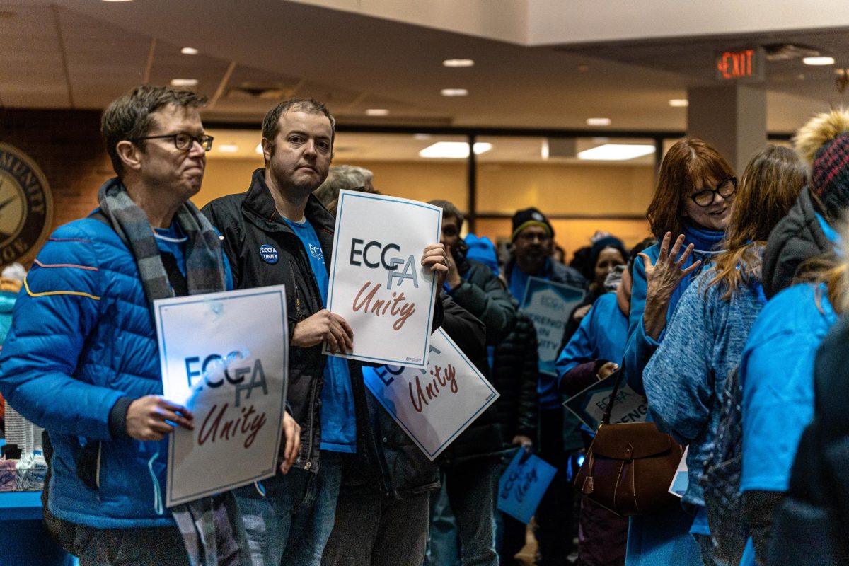 Members of Elgin Community College Faculty Administration (ECCFA) members lineup with signs before entering the Board of Trustees' monthly meeting outside the Siegle Auditorium, on January 27, 2026. Over 300 professionals work at ECC, ranging from full-time to adjunct faculty.