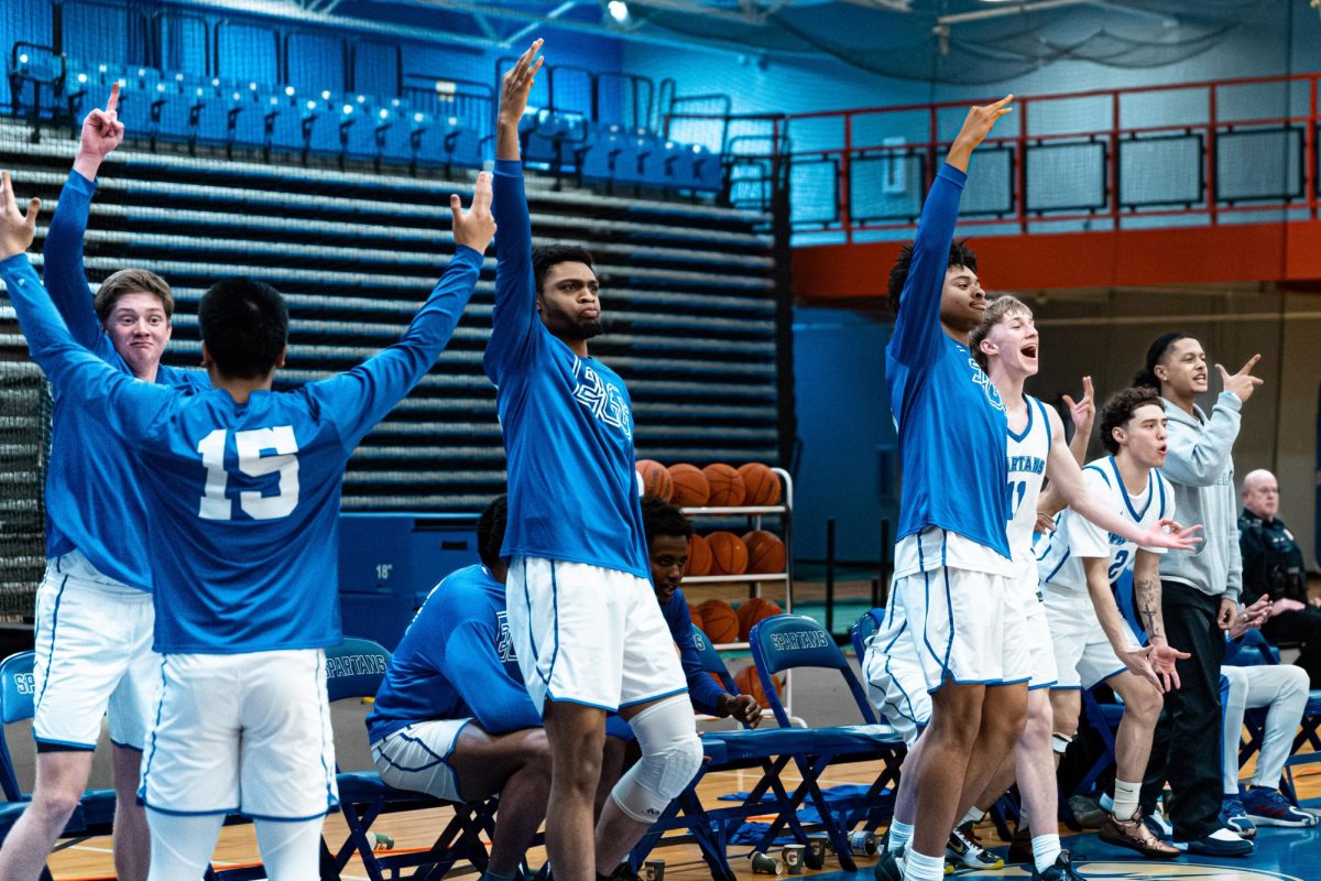 The Spartans celebrate consecutive scoring runs in the second half, on January 13th 2026. The men's team would outscore Oakton 83-64, with 54 of those points coming from the second half alone.