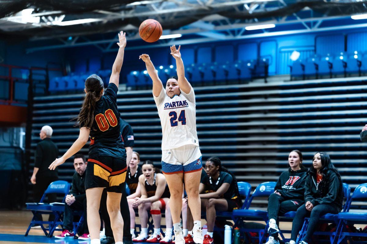 Guard Abigail Esparza beats her defender, shooting a three pointer over Waubonsee Community College, on Feb. 12, 2026. Esparza has had success from the arc in her time with the Spartans, shooting 35% from three, averaging 3.4 three-point field goals a game.