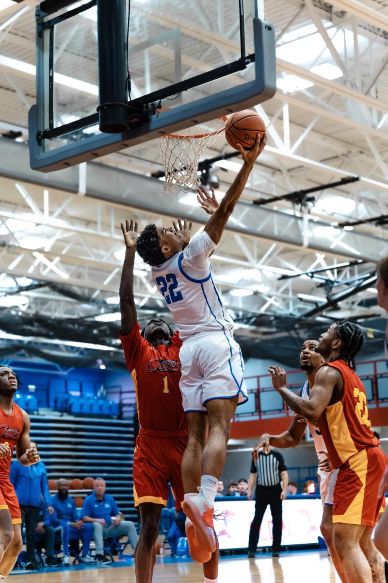Forward Jaylen Wells makes the tough reverse layup over Waubonsee Community College on February 12, 2026. Wells used his 19 minutes to score 13 points and 6 rebounds, the most points and rebounds this game from a reserve by the Spartans.
