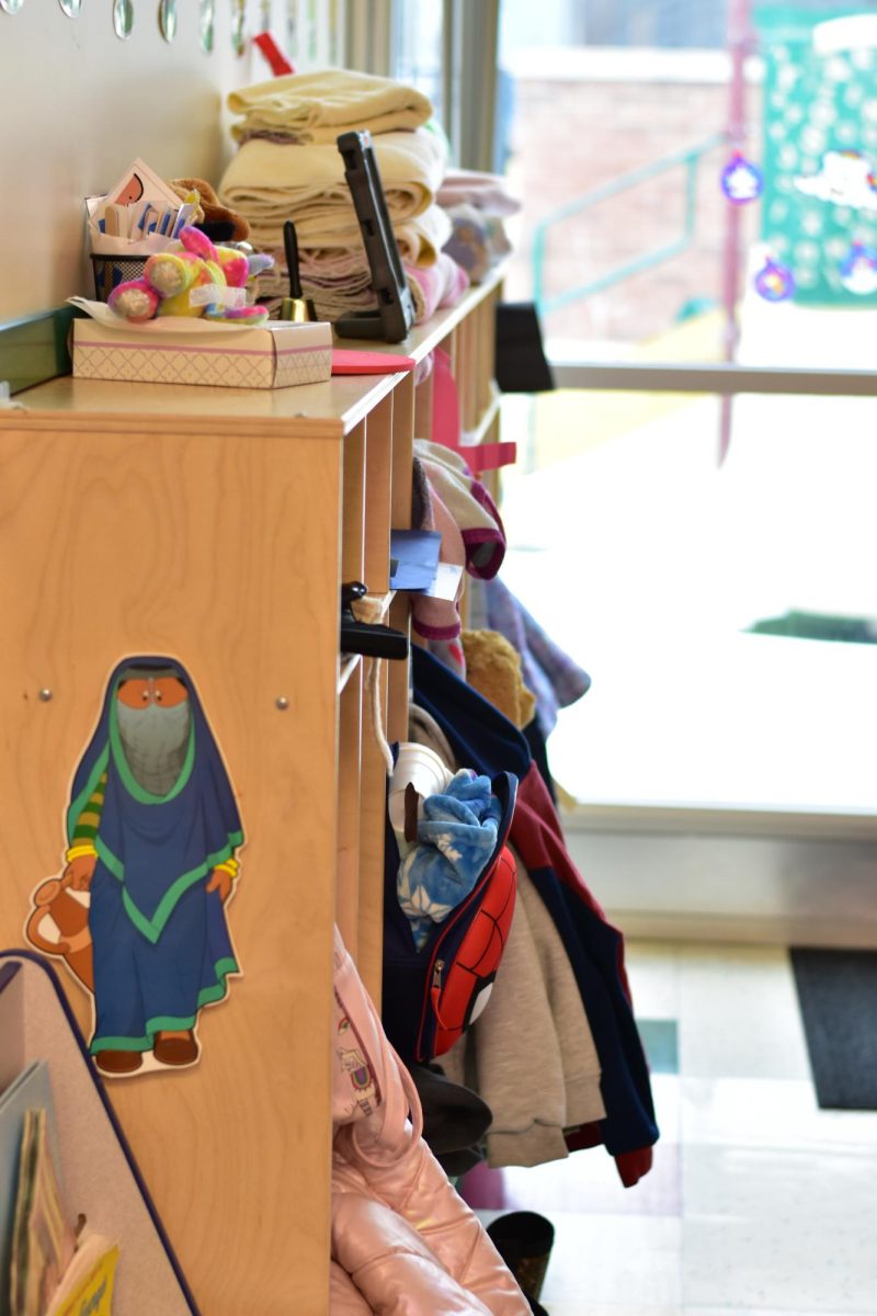 Children's coats hang in their cubbies while they play in a different room. Feb 4, 2026.