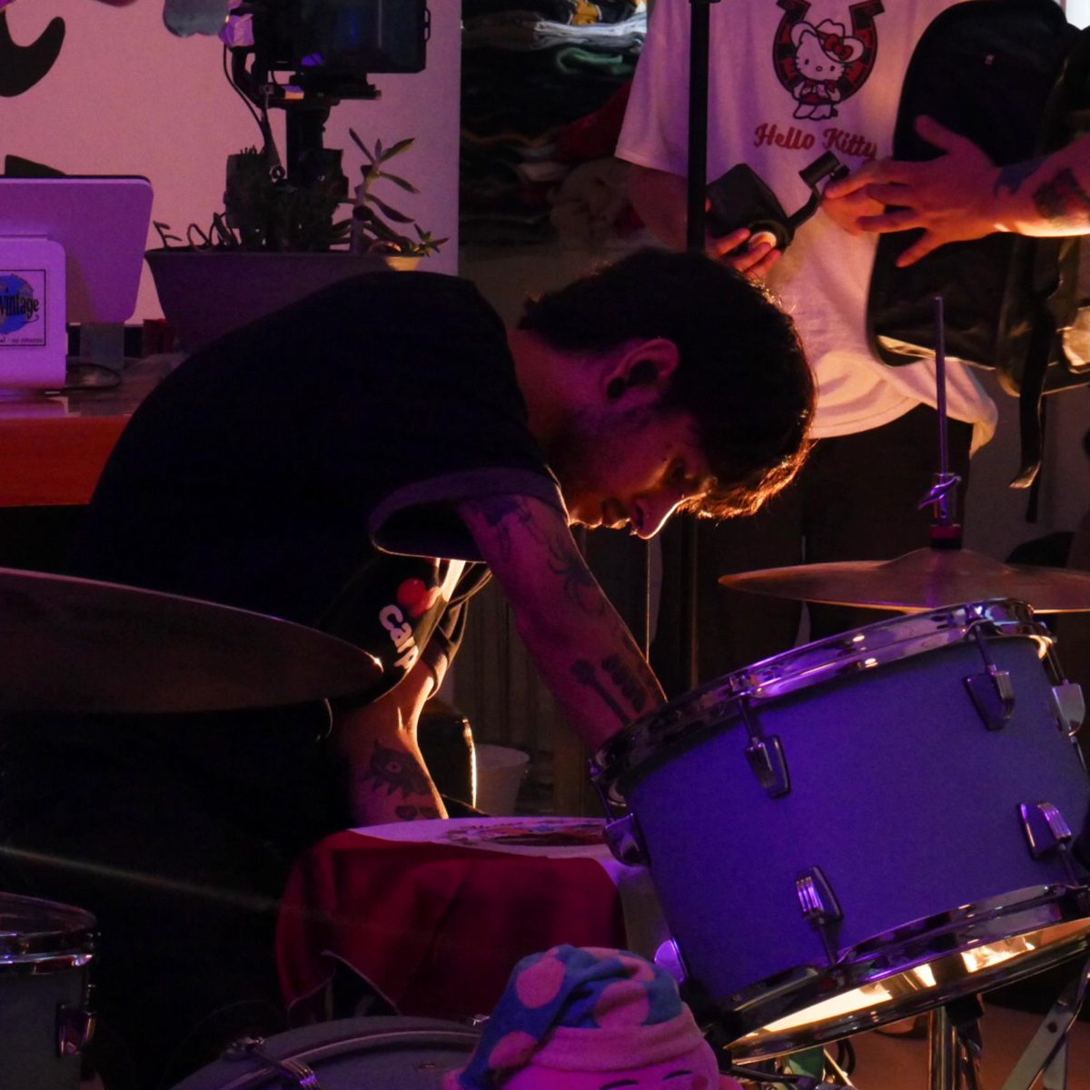 Brian Rodriguez, drummer of Vatos Tristes, at the "Sugar Water" music video shoot at Elgin Vintage on June 27, 2025. Rodriguez was a self-taught drummer who formed the band by posting on Instagram looking for members who were interested in making Latin-influenced music.