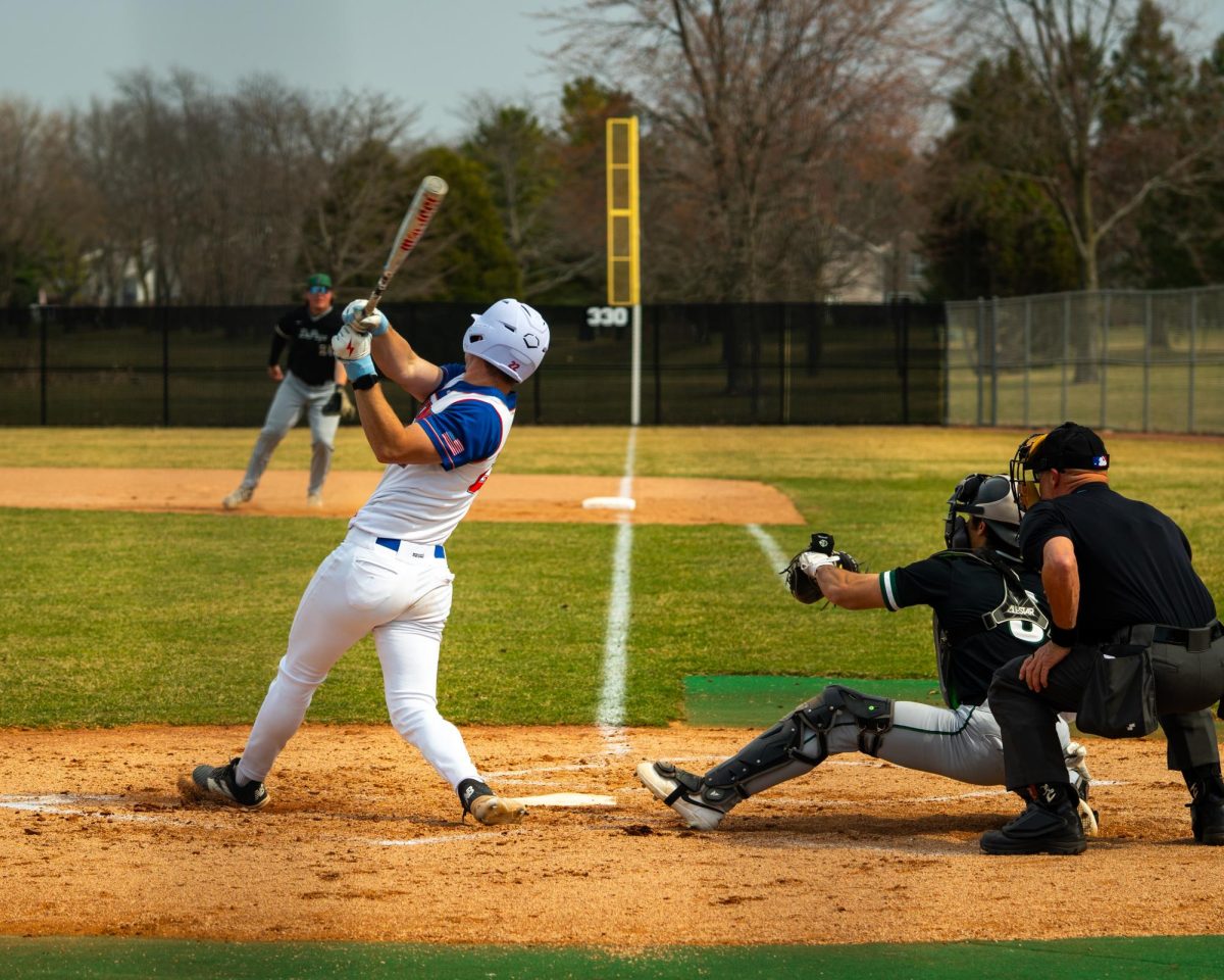 Matthew Brunscheen, Spartans batter, hits the ball as Matthew Betancourt, College of DuPage catcher, reacts to the play during the first game of the season at the Home of the Spartans on Mar. 25, 2026.