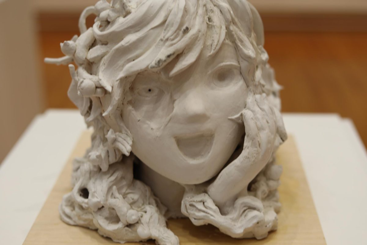 White stone sculpture of a face.