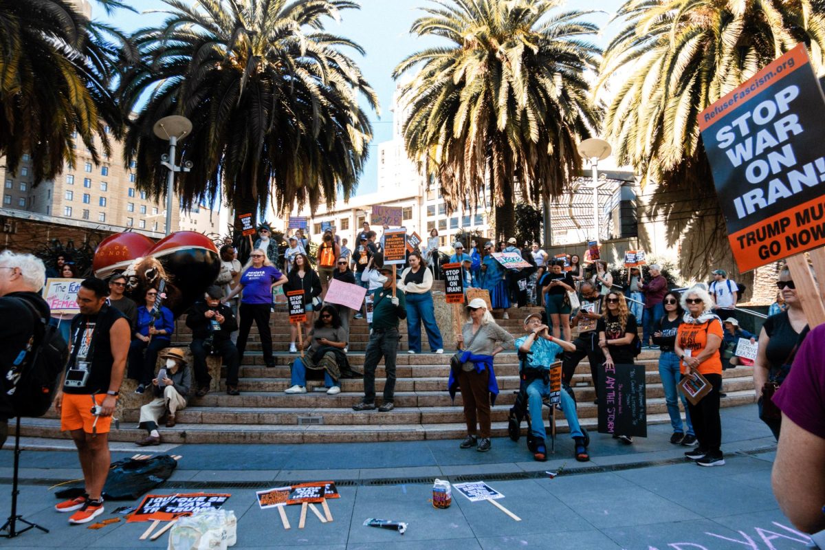 Protestors gather and listen to speakers in Union Square on Mar. 8th, 2026. The event  had over 50 spectators attended, with many vocal and critical of the Trump administration and their economic and foreign stances.