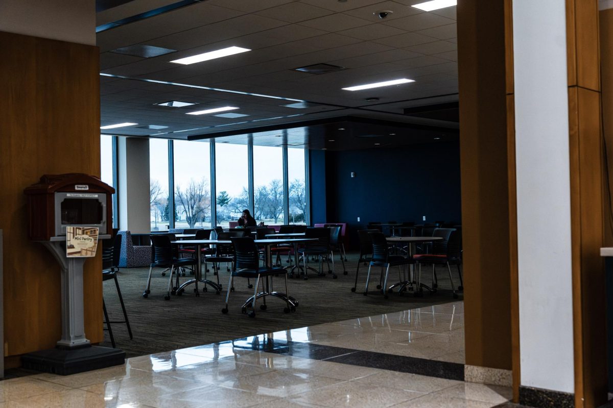A student works alone in the student lounge behind the cafeteria on Mar. 26th, 2026. As students disperse past 5pm, lounge areas begin to open up, leaving space for students to have quiet, less crowded spaces to work in.