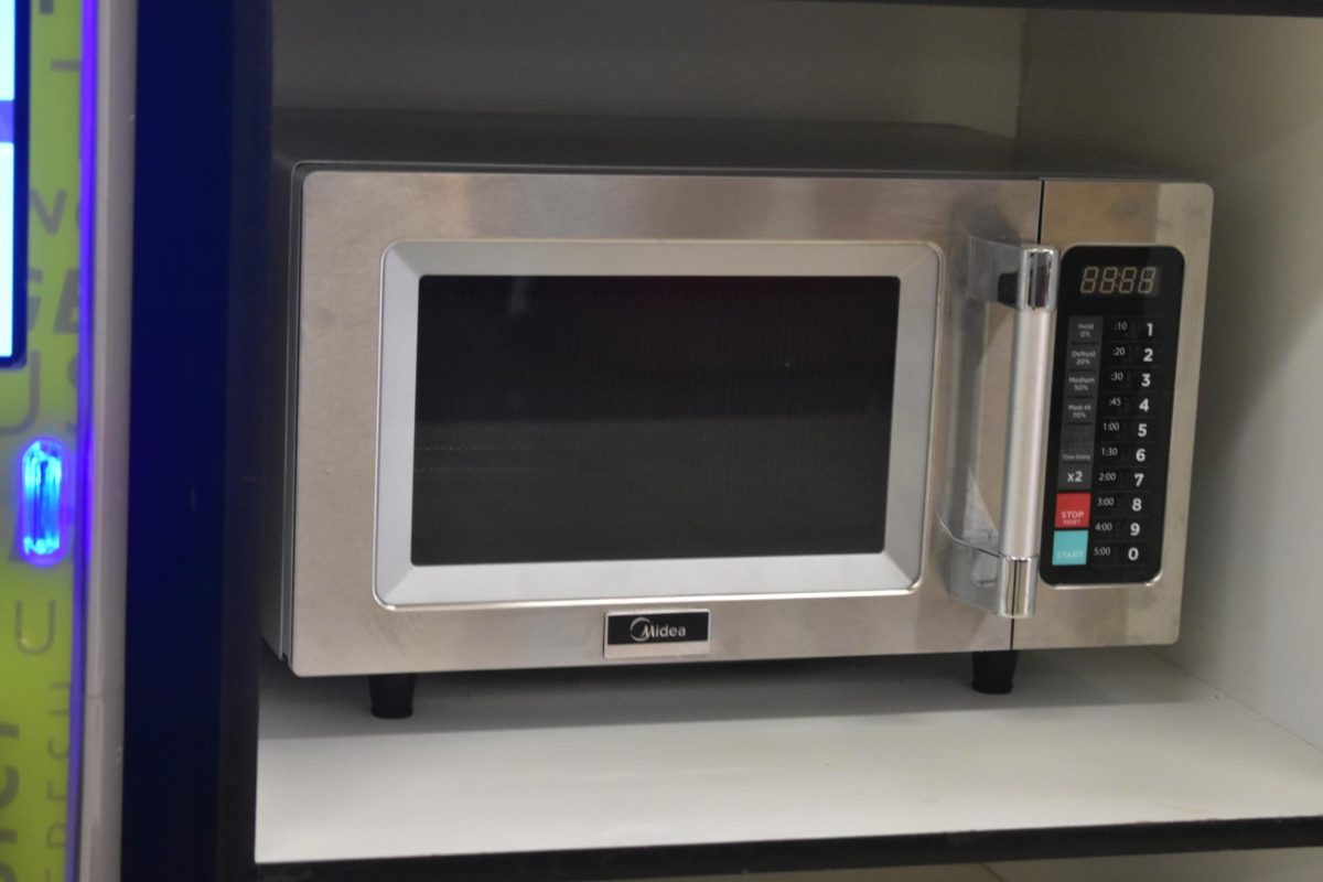 A community microwave sits in building B that any student can use on Mar. 23, 2026. The microwave allowed people to bring food from home and warm it up to eat.