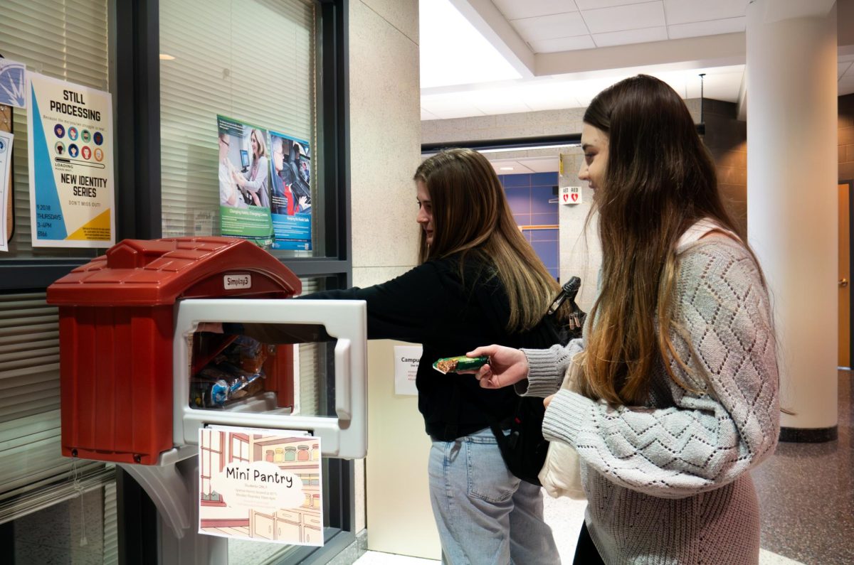 Students grabbing snacks from the mini pantry located in Building F at Elgin Community College on March 9, 2026. Spartan Pantry’s regular business hours are currently Monday through Thursday, 10:00am-4:00pm, making it difficult for some students who aren't able to visit to get meals and essentials.