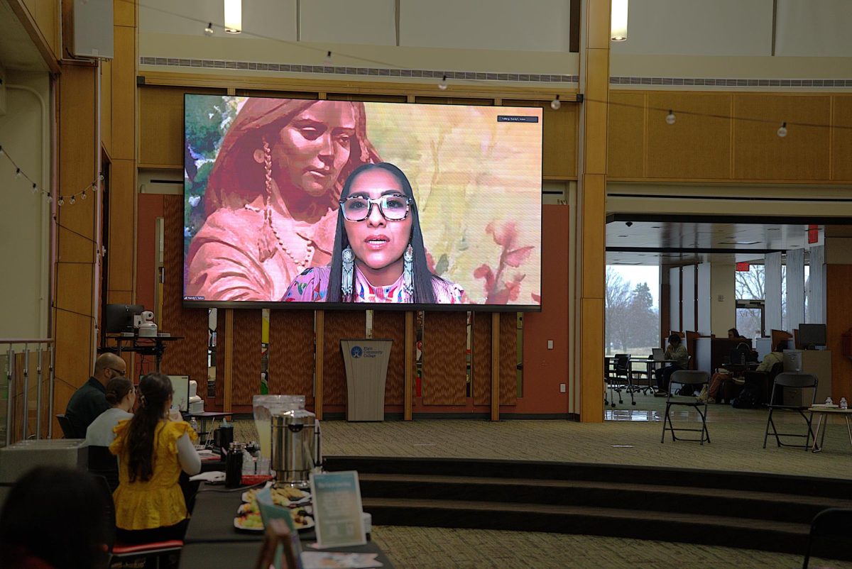A snack table beneath a speaker on a screen.