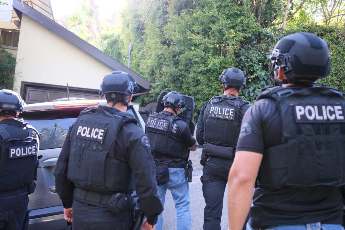 Los Angeles Police Department officers work during the arrest of David Burke, a 21‑year‑old musician known professionally as D4vd, on suspicion of murdering 14‑year‑old Celeste Rivas, at an undisclosed location, U.S., released April 16, 2026. LAPD via X/Handout via REUTERS
