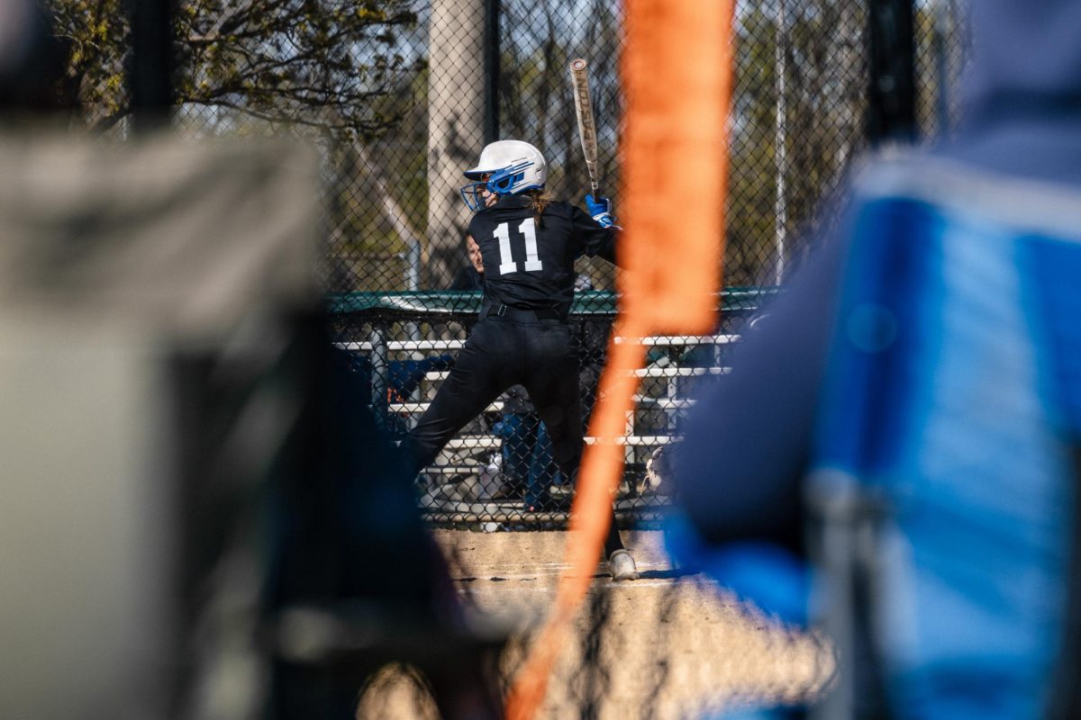 Fans of Elgin Community College's softball team watch on as Alyson Sebahar steps up to the plate, on Apr. 20, 2026. Audience members were vocal throughout the game, cheering on batters and pitchers as they mounted their comeback against Prairie State College.
