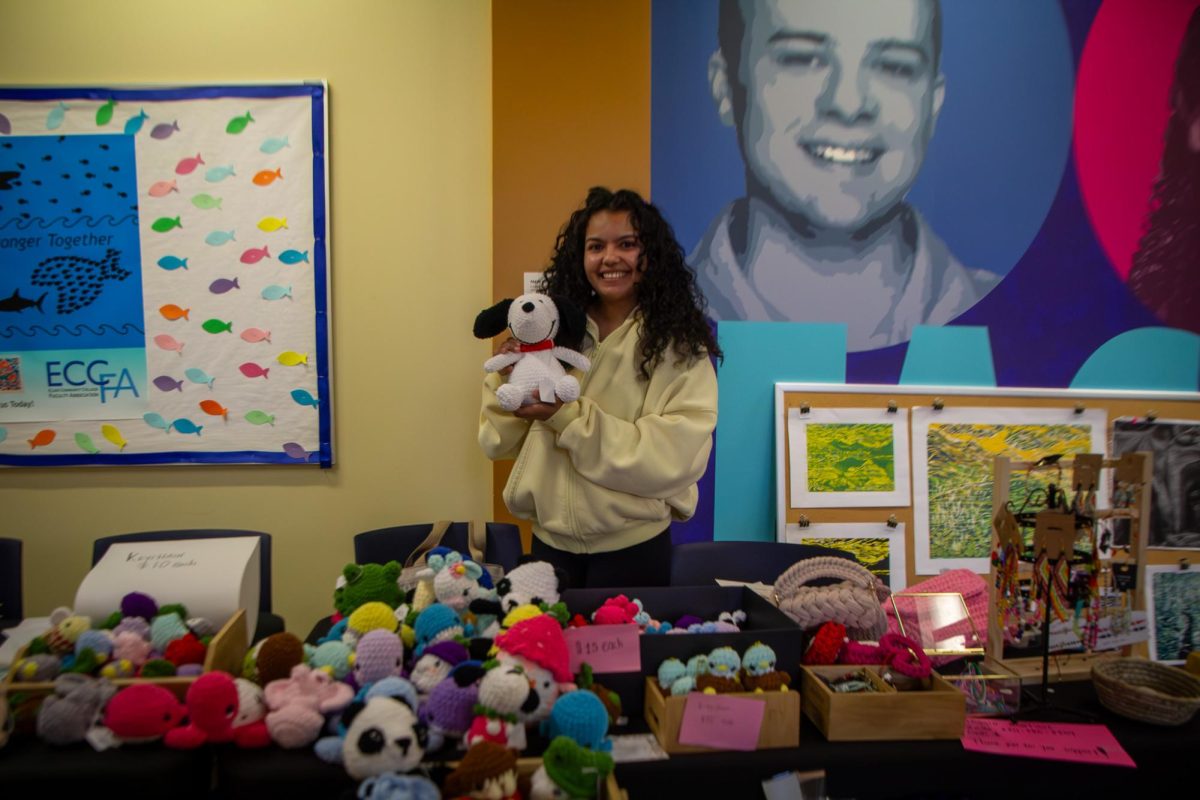 Anggie Martinez, an ECC student and member of the Art & Design Club, stands among her crochet creations at the ECC Art & Design Club Art Sale on Apr. 7, 2026. Martinez’s crocheted items included animals, fictional characters, and flowers.