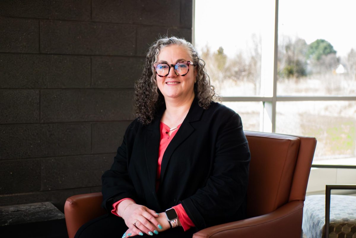 Angela Boque, Branch Information and Technology Manager, sits inside Gail Borden Public Library Rakow Branch on April 7, 2026. “Not every student can afford reliable internet or updated software at home.” said Boque.