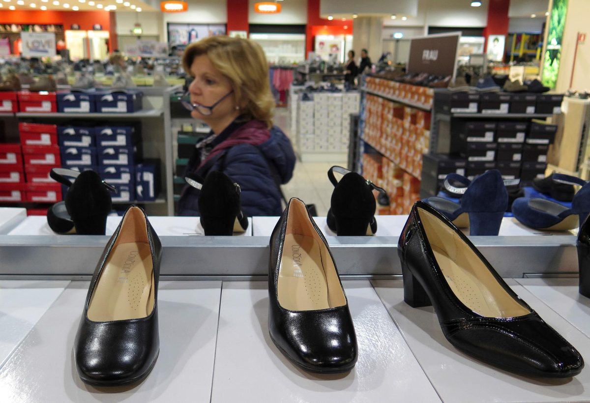 A woman looks for shoes in a shop in Rome, Italy, April 10, 2016.   REUTERS/Max Rossi